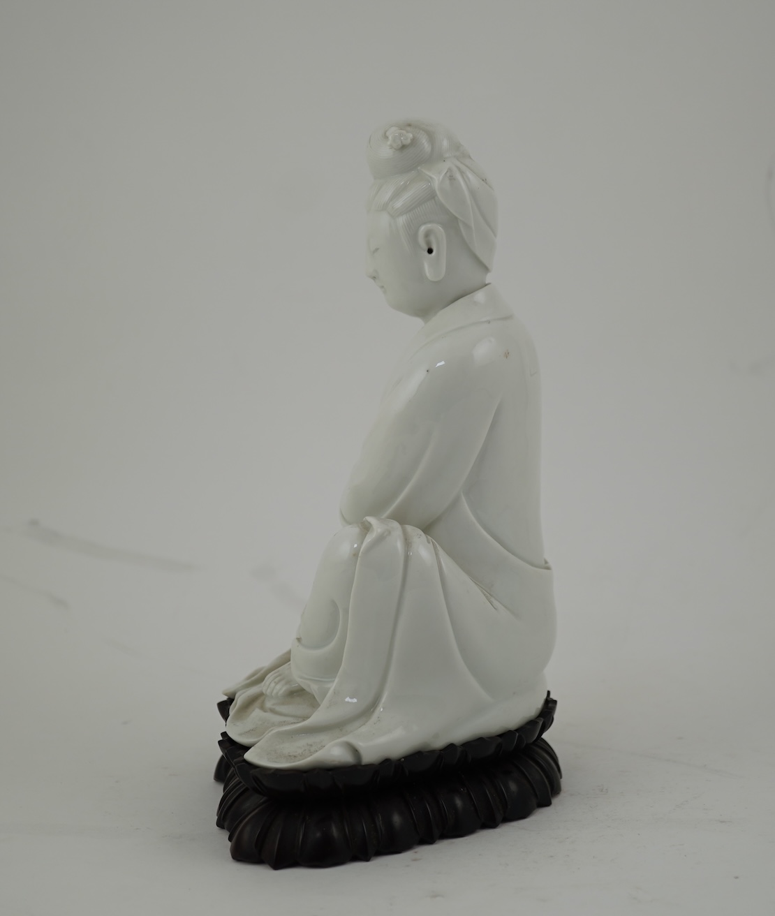 A Chinese blanc-de-chine seated figure of Guanyin, late 19th/early 20th century